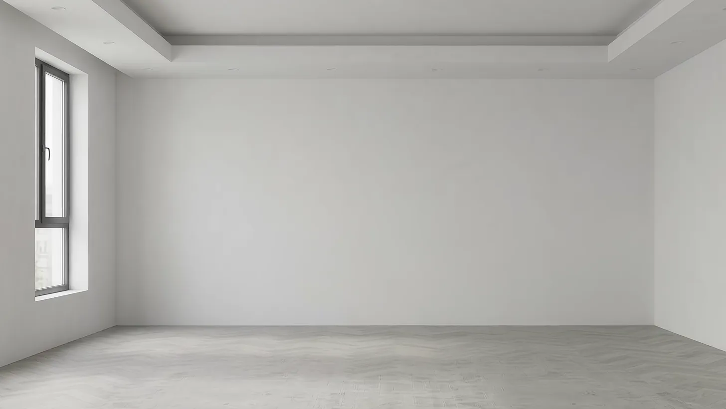 An empty room with white plaster walls, a tall window and a coffered ceiling